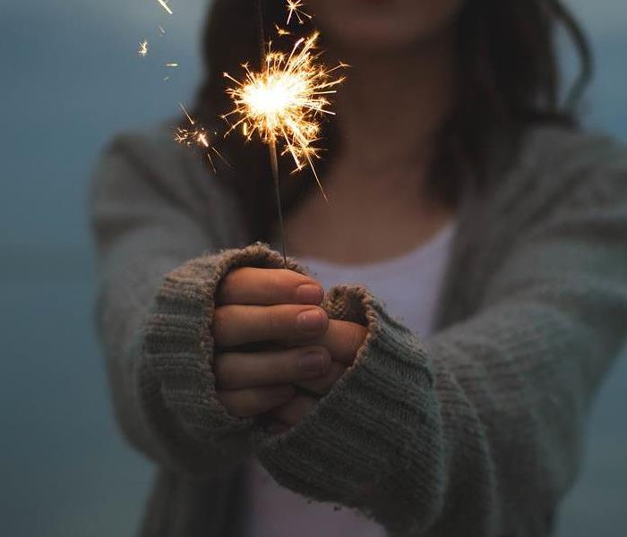 Girl holding sparklers 